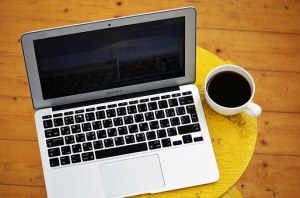 Laptop and coffee in mug